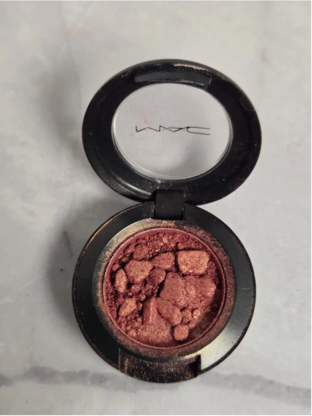 MAC Cosmetics brand Eyeshadow in the Shade Expensive Pink.